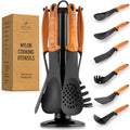 Set of nylon cooking utensils with wooden handles on a stand, next to a box labeled 'Nylon Cooking Utensils' by Zulay Kitchen.